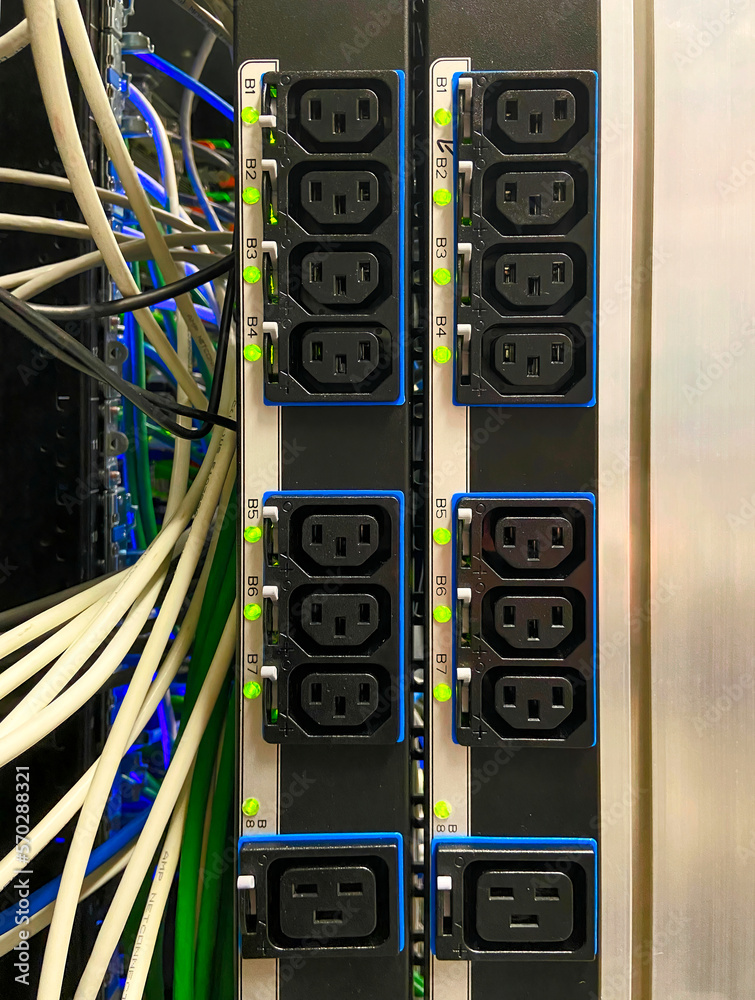 Power sockets on power bar mounted on side of data equipment rack