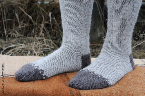 Knitted high socks with a pattern.  Front view.