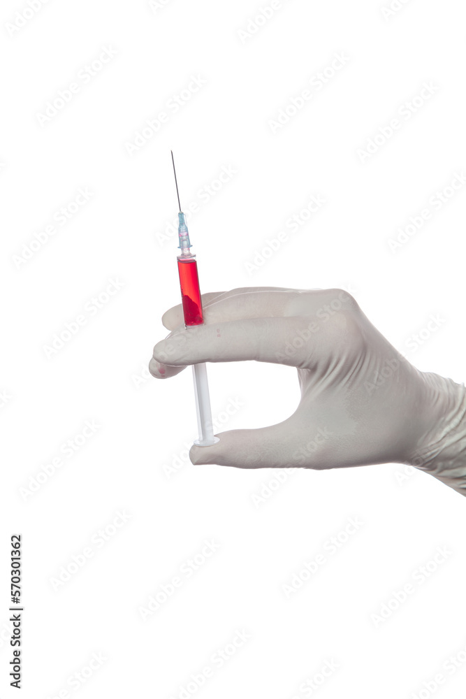 A hand in medical glove releases air from a syringe.... A hand in medical glove releases air from a syringe....