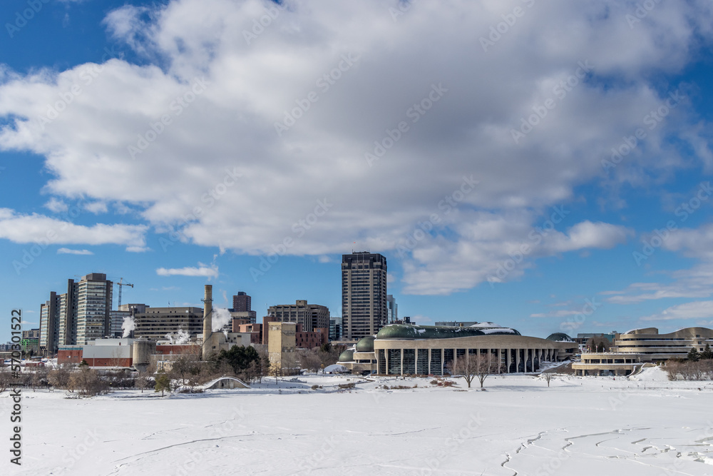 Fototapeta premium Having a walk in the Majors Hill Park in downtown Ottawa Canada with view to historical buildings at a cold but sunny day in winter.