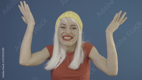 Surprised Lady is saying wow and smiling on green screen background. Slog2 ungraded LOG 10bit 422 ProRes raw chroma key footage. Surprise exciting news. Discount and sale concept photo