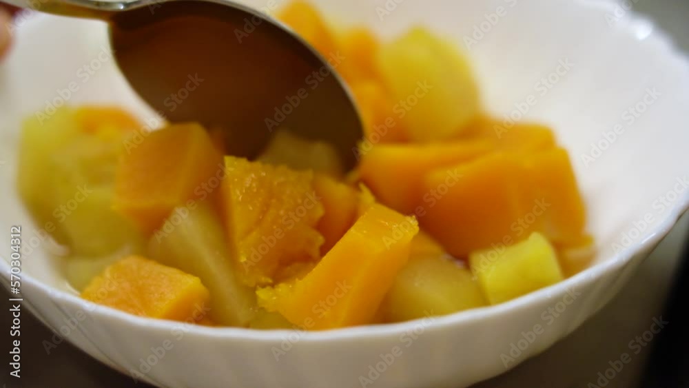 Orange pumpkin is cut into pumpkin, showing readiness in white plate. Orange pumpkin is cut into pumpkin, showing readiness in white plate.