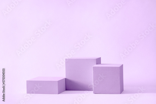 Three blocks of podium square cubes of different heights for displaying and advertising the product. Podium mockup for presentation. High quality photo