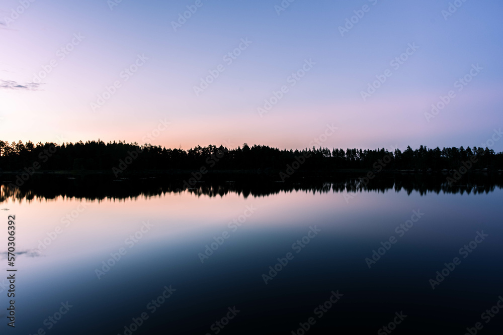 Fototapeta premium Sunset over a beautiful lake in Sweden