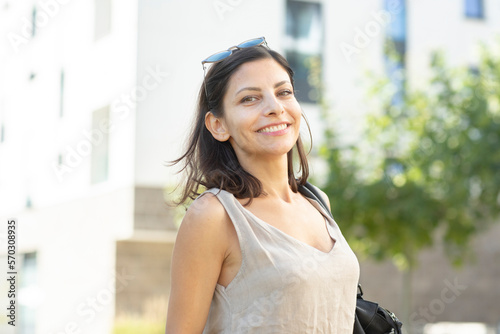 Portrait of smiling mid adult woman standing outdoors photo