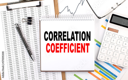 Принти на полотні CORRELATION COEFFICIENT text on notebook with chart, calculator and pen