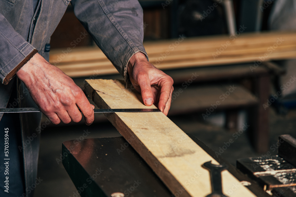 Work on woodworking machines and saws in a furniture workshop Work on woodworking machines and saws in a furniture workshop