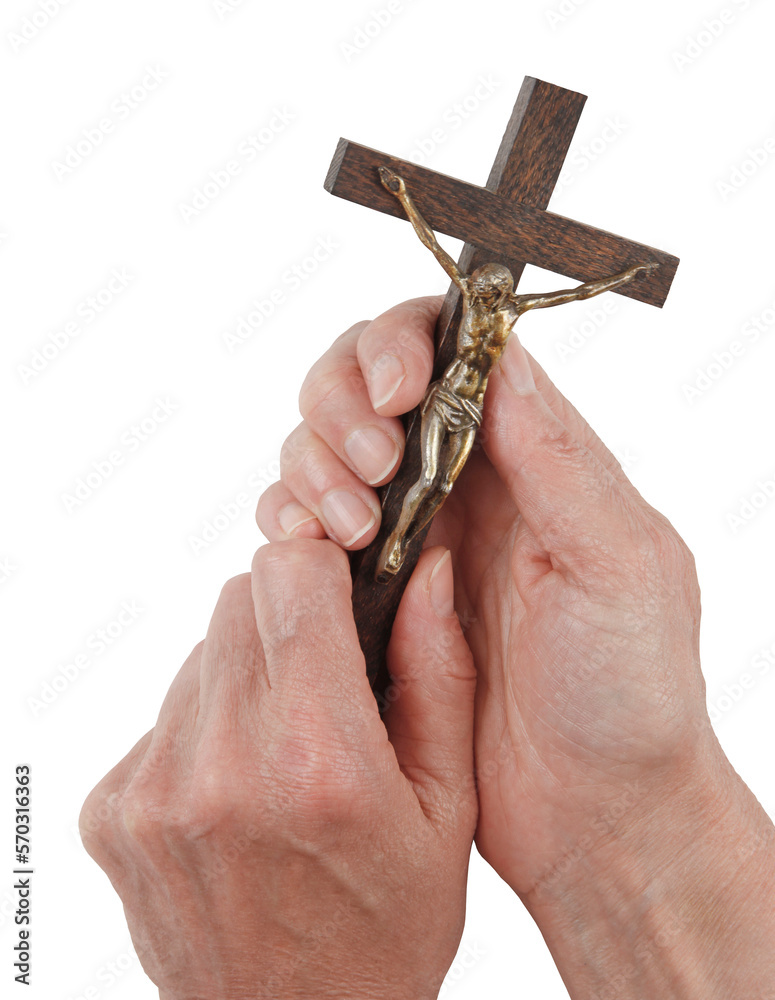 Female hands holding up a small statue of Jesus Christ on the Cross
