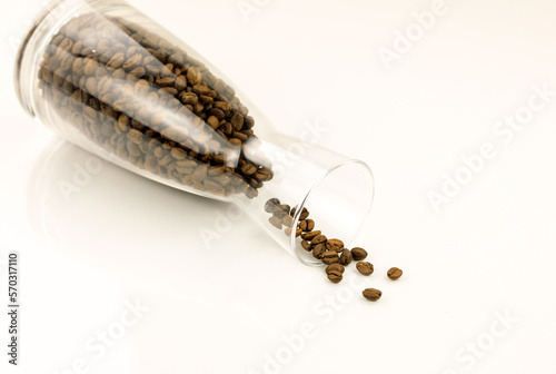 vase filled with coffee beans white background creative