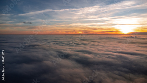 Beautiful sunset with an inversion that looks like a flowing sea. Sunset in autumn under Jested. Photographed by drone