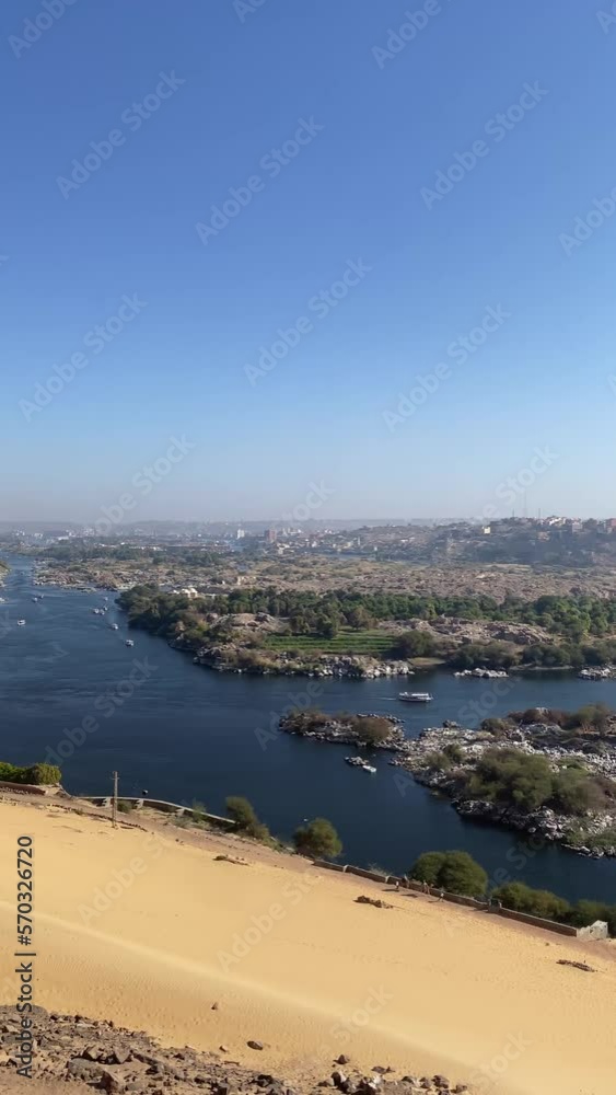 Vertical beautiful view of egypt river and desert landscape scenery under blue sky Vertical beautiful view of egypt river and desert landscape scenery under blue sky
