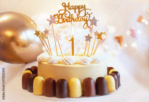 Birthday cake with candles of number one and decoration. Sweet, delicious food. Celebrating child's first year birthday.