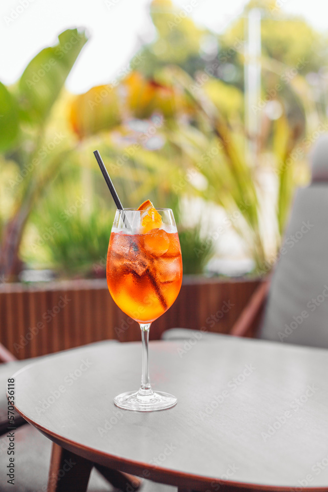 custom made wallpaper toronto digitalA glass of orange cocktail Spritz on a table in a bar