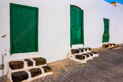 Typical green doors of houses in Teguise Street in Island of Lanzarote Canary Islands, Soain  photo