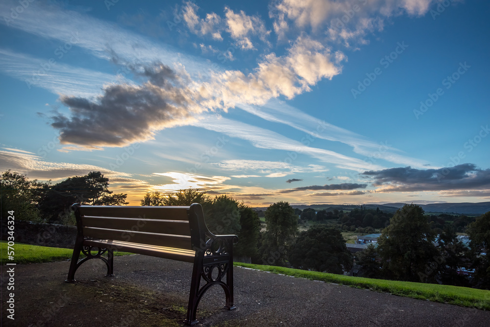 Viewpoint from bench at sunset in Peel Park Kirkintilloch, Scotland. 