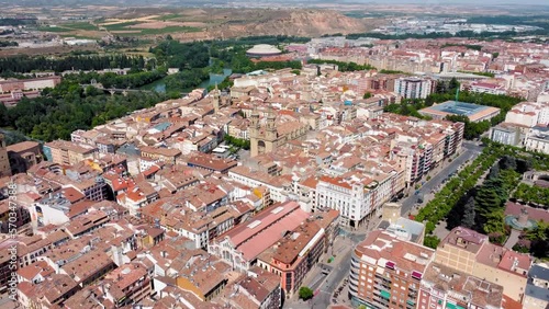 City of Logrono perspective from above. View of old town center with beautiful Concatedral de Santa María de la Redonda. Drone forward creating a panoramic view of the city. In background Ebro River