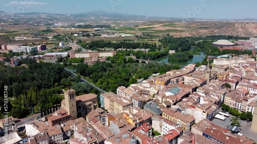 Drone backward over the city of Logrono. Rooftop view of this famous and historic city, capital of La Rioja Province. View of Ebro river. In the center of the city is Mercado Square and the Cathedral photo