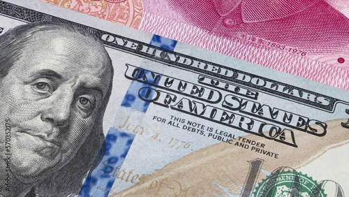 American 100 dollar and Chinese 100 Yuan banknotes moving. Business and Finance concepts. Seamless loopable animation.