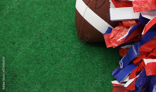football and pompom on turf