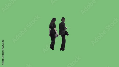 Two beautiful young women in business black suits are walking together