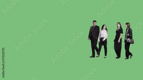 A group of people in office clothes are walking and talking to each other. Alpha channel background