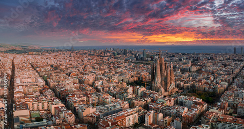 Photography Aerial view of Barcelona City Skyline and Sagrada Familia Cathedral at sunset