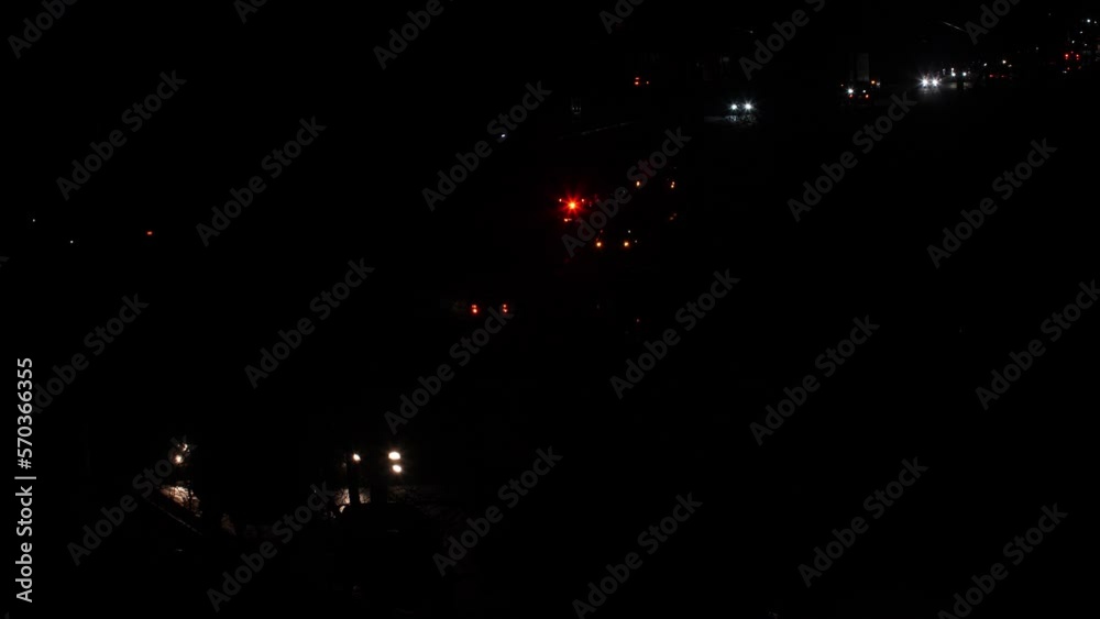 Police and ambulance on road accident at night. Red and blue Police lights and ambulance lights on the city highway among the many cars. Emergency vehicle lighting helps with an accident on a freeway Police and ambulance on road accident at night. Red and blue Police lights and ambulance lights on the city highway among the many cars. Emergency vehicle lighting helps with an accident on a freeway