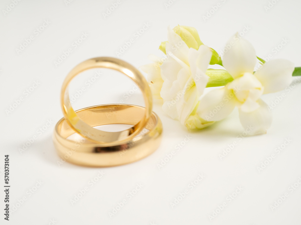 Wedding rings on a light background. Gold rings. Close-up. Wedding rings on a light background. Gold rings. Close-up.