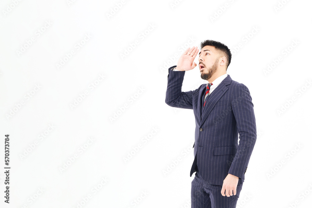 画面の上の方を見つめるビジネスマン 画面の上の方を見つめるビジネスマン