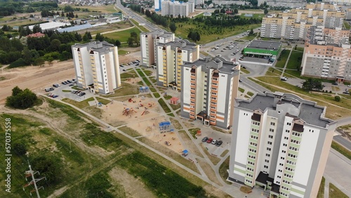 A new recently built neighborhood of apartment buildings. Drone video.