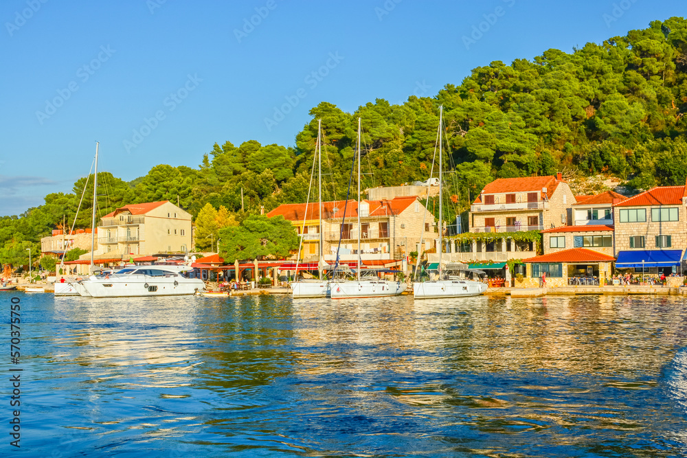 Boats docked in the small harbor at the picturesque fishing village of Govedari, Croatia, on the island of Mljet, along the Dalmatian Coast of Croatia.