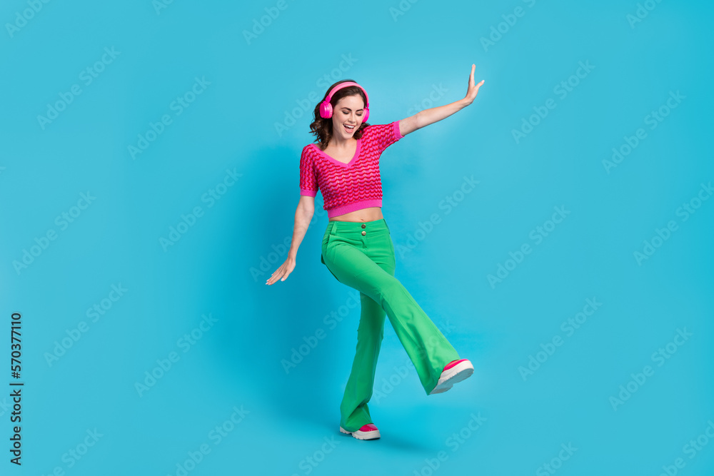 Full size photo of good mood girlish woman with wavy hairstyle wear pink top dancing eyes closed isolated on blue color background