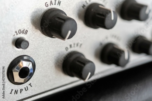 Guitar amplifier, an electronic device designed to amplify an electrical sound signal emitted by an electric guitar. Close-up