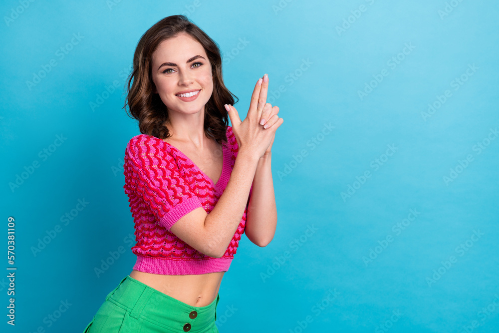 Photo of positive crazy lady guard protecting boss showing pistol sign having fun empty space isolated on blue color background Photo of positive crazy lady guard protecting boss showing pistol sign having fun empty space isolated on blue color background