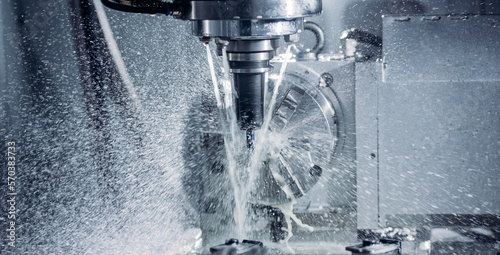 Fotografie Coseup Working CNC turning cutting metal Industry machine iron tools with splash