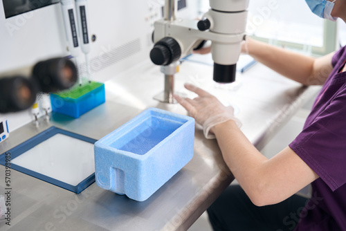Clinic employee prepares a biomaterial for vitrification