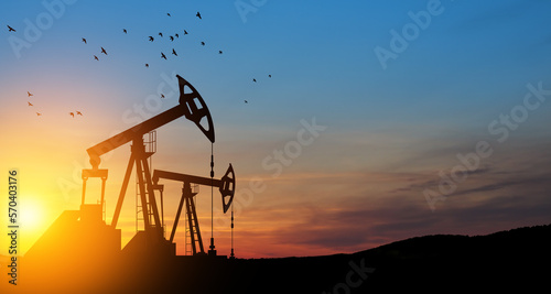 The change in oil prices caused by the war. Oil prices are rising because of the global crisis. Oil drilling derricks at desert oilfield. Crude oil production from the ground. Petroleum production.