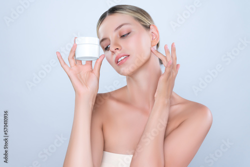 Alluring beautiful perfect cosmetic skin woman portrait hold mockup jar cream or moisturizer for skincare treatment, anti-aging product in isolated background. Natural healthy skin model concept.