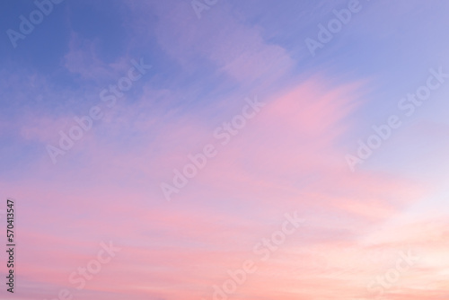 Sky with soft and fluffy pastel pink and blue colored clouds. Sunset background. Nature. sunrise. Instagram toned style © flowertiare