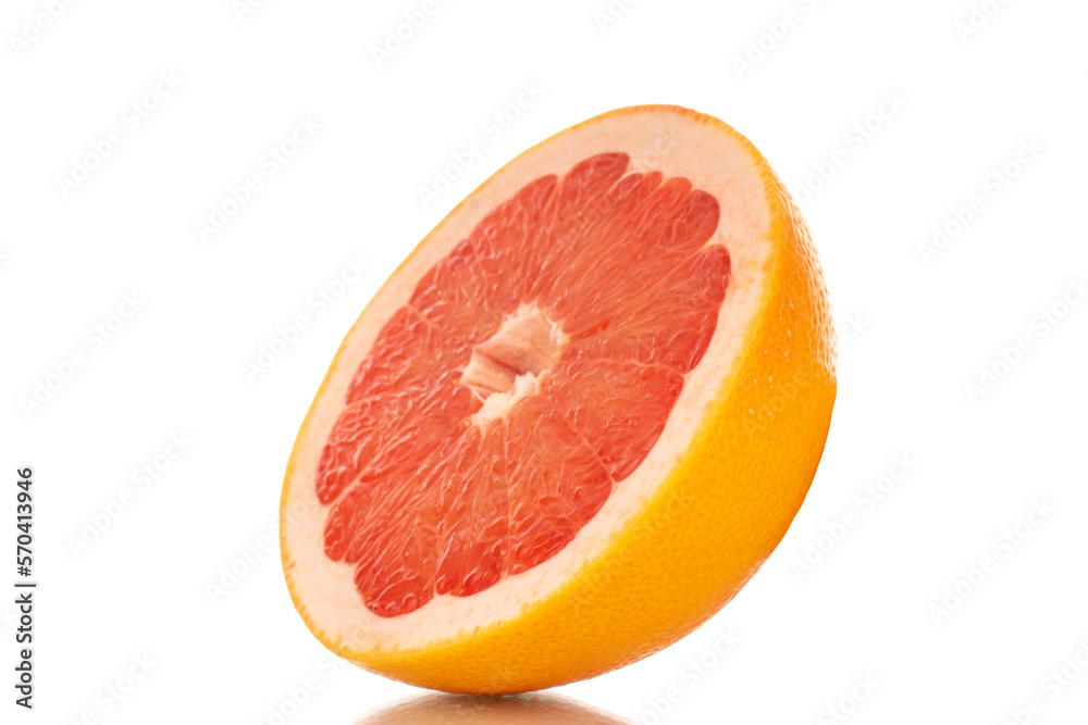 One half of a ripe grapefruit, macro, isolated on white background. One half of a ripe grapefruit, macro, isolated on white background.
