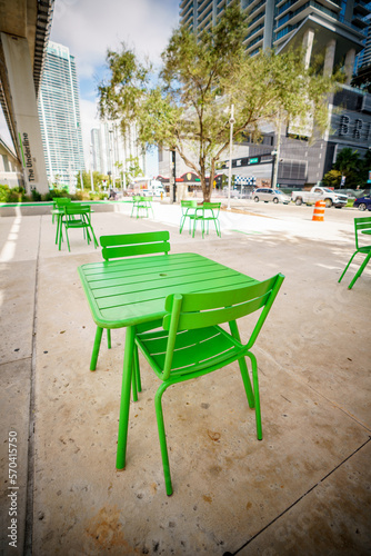 Public green tables and chairs at the Brickell Underline Miami