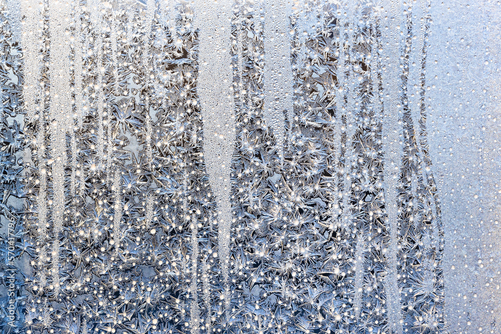 horizontal natural background - sunshine on frost on surface on home window glass in sunny cold winter morning horizontal natural background - sunshine on frost on surface on home window glass in sunny cold winter morning