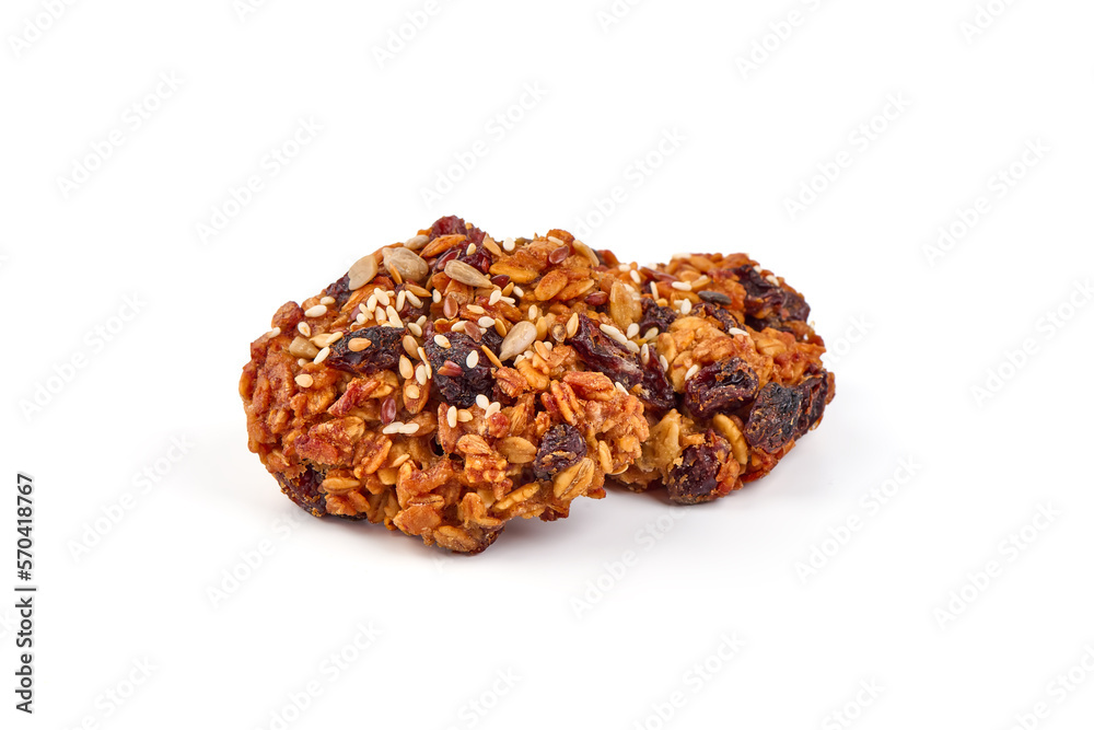 Homemade oat cookies with seeds, isolated on white background.