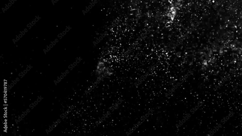 Shot of real dust particles floating in the air. Dust Particles Background. Macro slow motion shot, Use blending mode (screen) Shot of real dust particles floating in the air. Dust Particles Background. Macro slow motion shot, Use blending mode (screen)