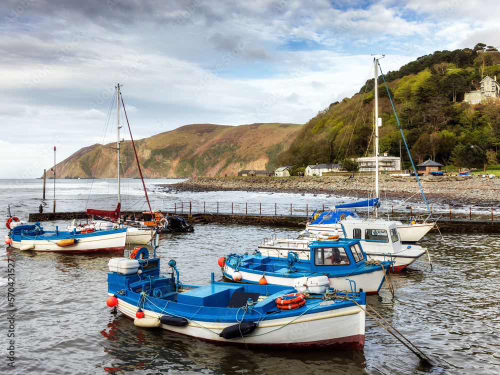 Historic fishing harbour of Lynmouth in Devon, England, at high tide.