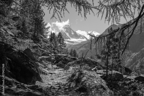 The Oeschinensee lake and the peaks in the clouds - Bernese alps. photo