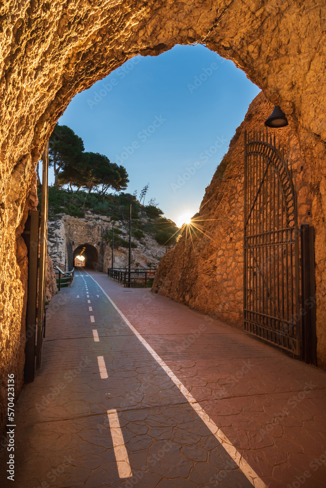 Tunnels of the Cantal, between Rincon de la Victoria and Cala del Moral, Malaga, promenade that runs through tunnels and cliffs facing the Mediterranean, at dawn.