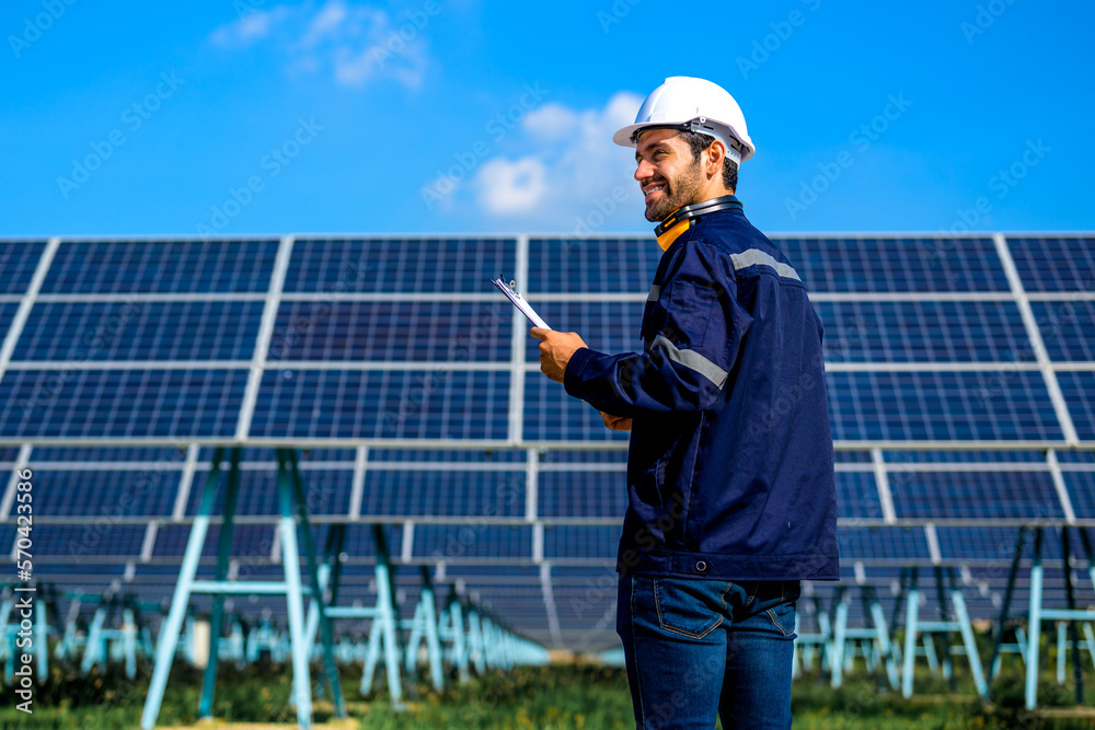 Energy Engineering portrait with solar panel at solar farm. Solar farm ...