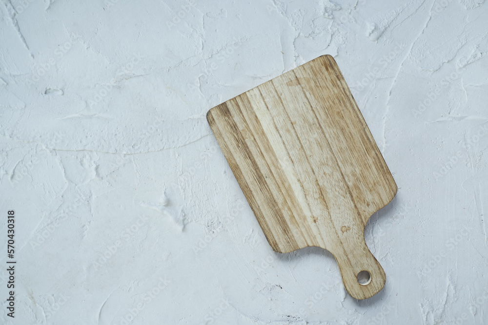 Fototapeta premium wooden chopping board on black background top down