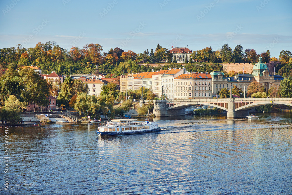 Boat movement on the Vltava and city view of Prague.